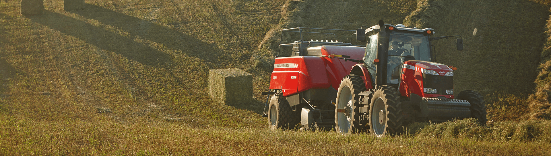 Massey Ferguson Tractor pulling a Baler